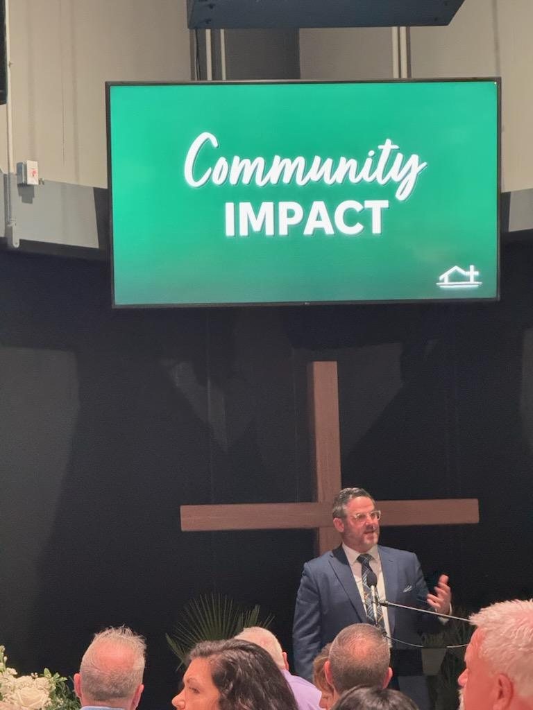 Brian Hawkins speaking at a community event